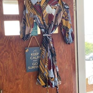 Laundry 100% silk unlined wrap around dress.